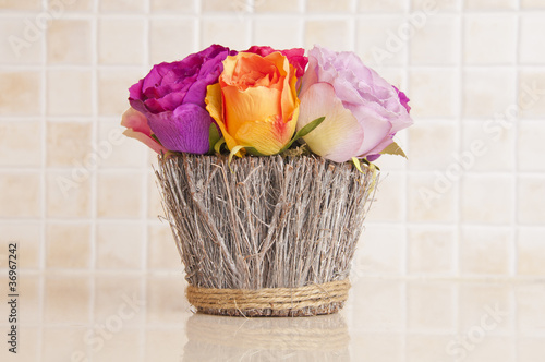 Photo: Fake flowers on the kitchen bench Fake flowers on the kitchen bench