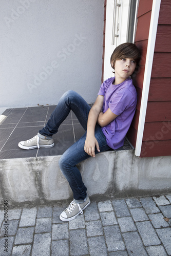 Photo: bored unhappy teenager bored unhappy teenager