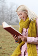 Photo: Girl out in nature reading book Girl out in nature reading book