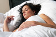 Photo: Attractive brunette woman is sleeping in her bed Attractive brunette woman is sleeping in her bed
