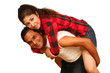 Smiling young Indian man piggybacking his pretty Wife
