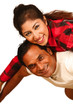 Smiling young Indian man piggybacking his pretty Wife