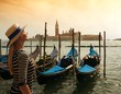 Beautiful woman in hat against Venice panorama