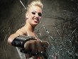 Punk girl breaking glass with a brass knuckles Punk girl breaking glass with a brass knuckles