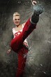 Punk girl breaking glass with her boot