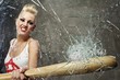 Punk girl breaking glass with a bat