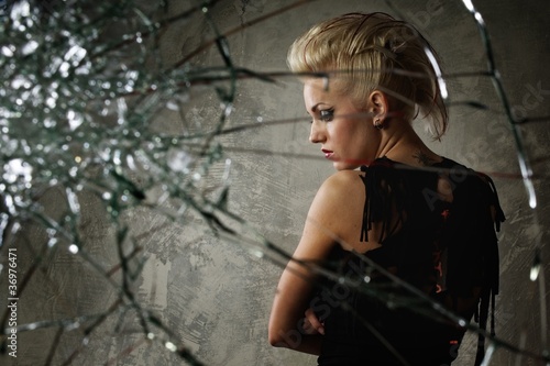 Photo: Punk girl behind broken glass Punk girl behind broken glass