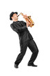 Portrait of a man in a suit playing on saxophone Portrait of a man in a suit playing on saxophone