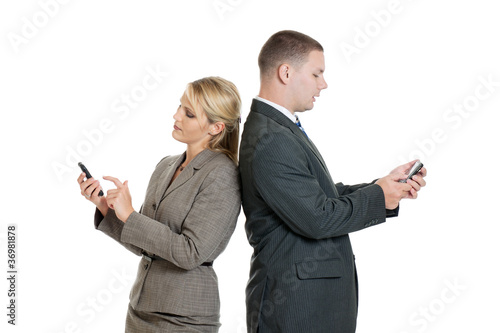 Photo: Business people back to back on smartphones Business people back to back on smartphones