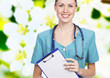 Smiling female doctor against flower background