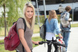beautiful girl go to the university with her friends