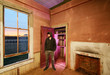 man in abandoned house