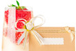 Macro glass of champagne with strawberry and event invitation