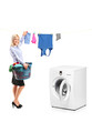 Foto: Young woman hanging clothes on clothes line next to a washing ma Young woman hanging clothes on clothes line next to a washing ma