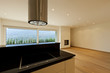 large room with kitchen island, window view