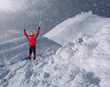 guy with an ice pick in the mountains in winter