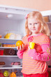 girl with food on background fridge