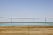Outdoor swimming pool with wooden deck
