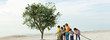 Ecology concept, children watering tree together