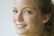 Young woman glancing sideways at camera, portrait