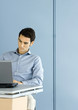 Man using laptop at desk