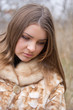 Young woman in a fur coat