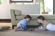 Mother and child playing with toy cars