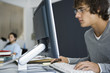 College student using computer in classroom
