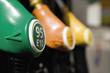 Gas pump nozzles in a row