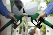 Refueling vehicle at gas station