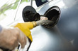 Refueling vehicle at gas station