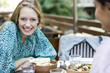 Young woman with friend at restaurant