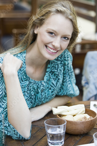 Photo: Young woman at restaurant, portrait Young woman at restaurant, portrait