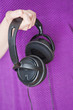 Woman holding headphones