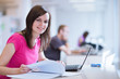 Photo: in the library - pretty female student with laptop in the library - pretty female student with laptop