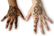 Two female hands of different human races with henna tattoos.