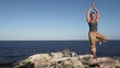 Woman doing a yoga exercise Woman doing a yoga exercise