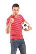 Young man cheering and holding a football