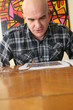 Foto: Portrait of a man with bald head, talking Portrait of a man with bald head, talking