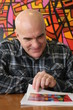 Foto: Portrait of a man with bald head, amused Portrait of a man with bald head, amused