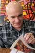 Foto: Portrait of a man with bald head, reading book Portrait of a man with bald head, reading book