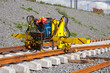Railroad track construction machine