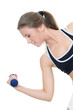 The girl does exercises with dumbbells