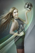 Foto: Blonde woman dancing with disco ball Blonde woman dancing with disco ball