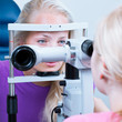 optometry concept - pretty, young female patient