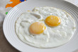 close up of fried egg on the plate close up of fried egg on the plate