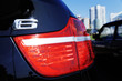 Back lights of the modern car on the street of city Back lights of the modern car on the street of city