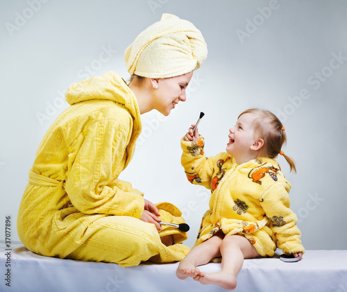Photo: Daughter and mother putting makeup after bathroom Daughter and mother putting makeup after bathroom
