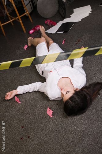 Photo: Nurse lying on the floor Nurse lying on the floor