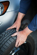 mechanic changing a wheel of a modern car